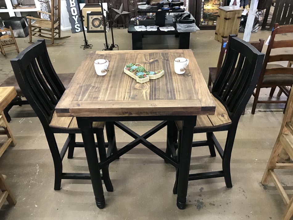 Alternate view of dining table set, with black turned legs, black chairs, and table top and chair seats in chestnut pine finish.