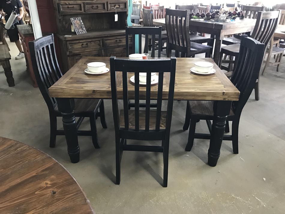 Rustic dining table in pine wood with black legs and chairs, available in Lubbock.