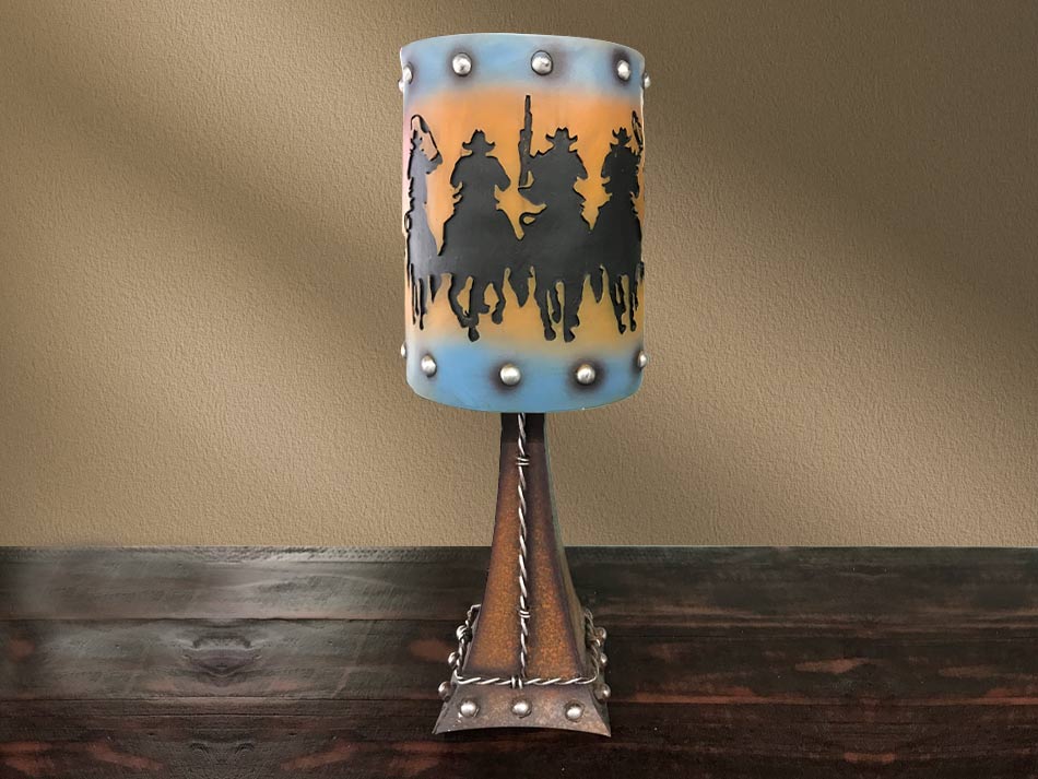 Vintage-style cowboy riders table lamp, perfect for pairing with rustic furniture. Available in Lubbock, Texas.