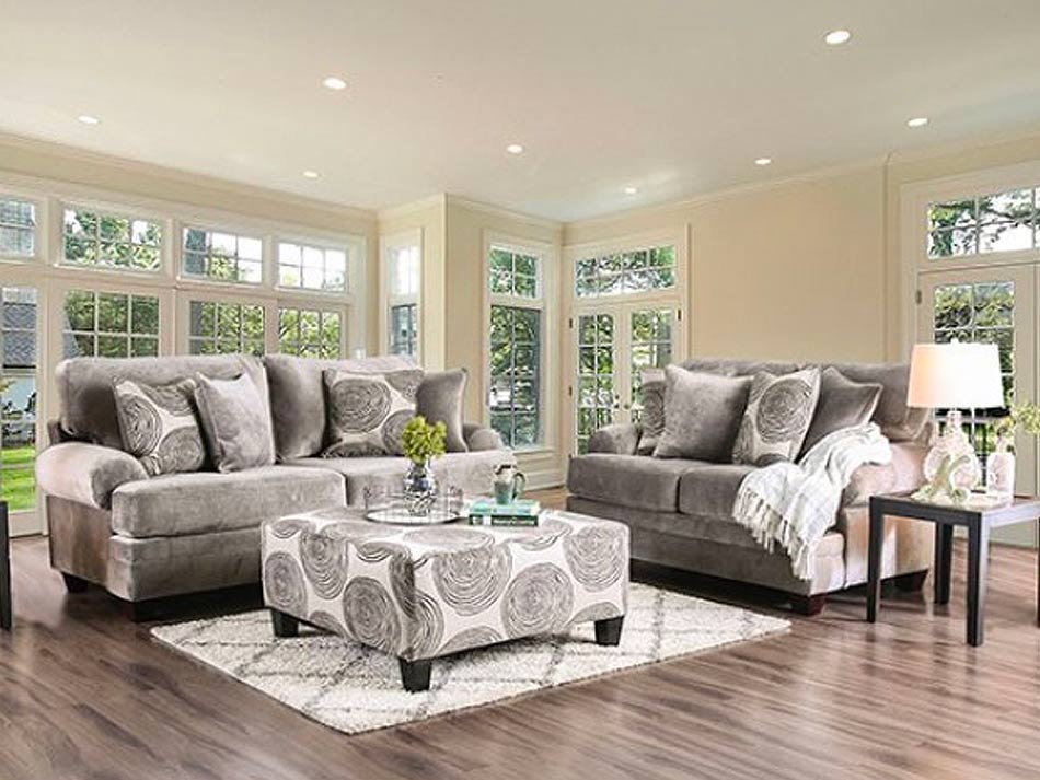 Beautiful living room ensemble with sofa, loveseat and ottoman, in soothing gray colors.