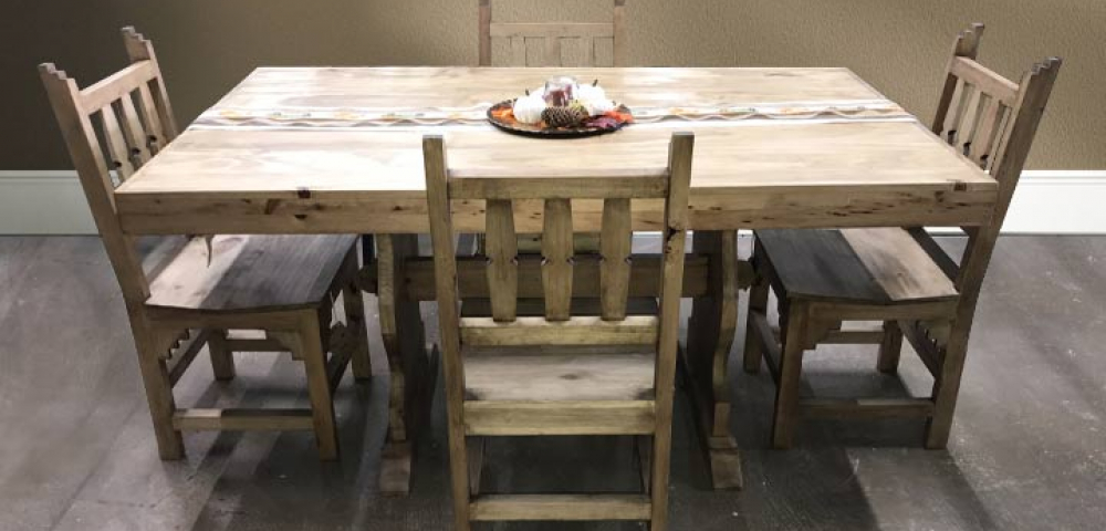 Beautiful rustic furniture dining room set in rustic-themed home.