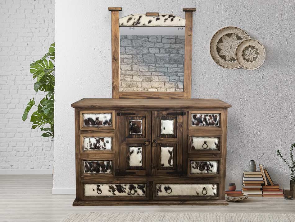 Hair-on hide dresser with rustic furniture design and iron hardware.