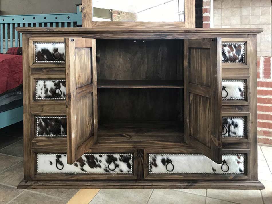 Rustic furniture dresser with middle cabinet doors open.