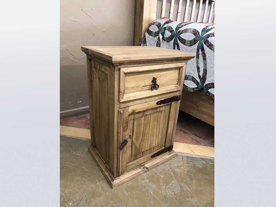 Side view of rustic furniture nightstand, with drawer and pull-open cabinet.