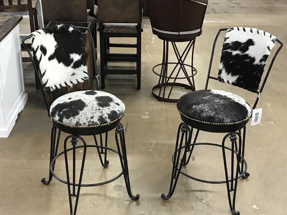 Charming parlor chairs in wrought iron with hair-on hide, available in Lubbock, Texas.