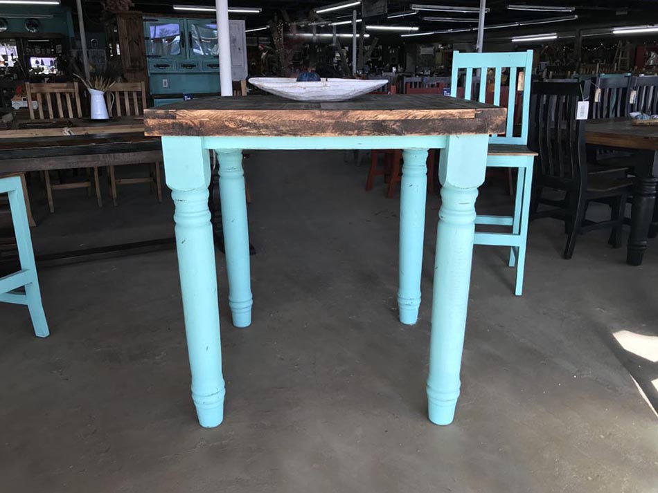 The Santa Rita dining table, shown in turquoise.