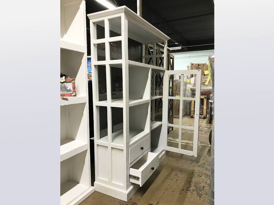 Side view of beautiful white curio cabinet and shelv storage unit, with glass-pane door.